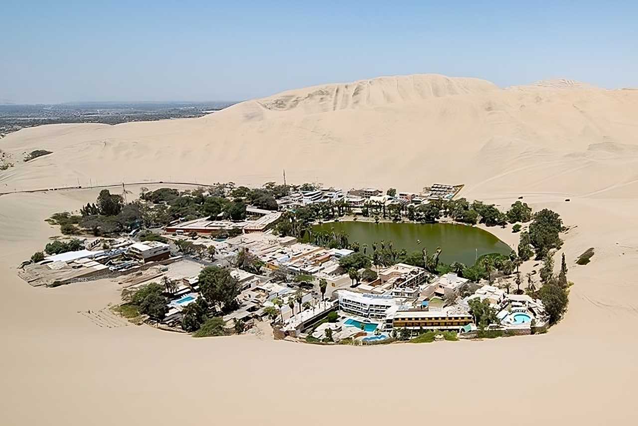 The Huacachina Lagoon is a large oasis of sulfurous waters located five kilometers west of the Peruvian department of Ica, in the middle of the coastal desert of the Pacific Ocean.