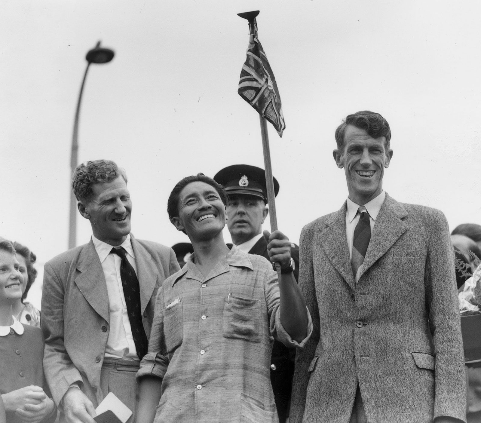 John Hunt, Tenzing Norgay, and Edmund Hillary arriving in Britain after climbing Mount Everest, 1953.