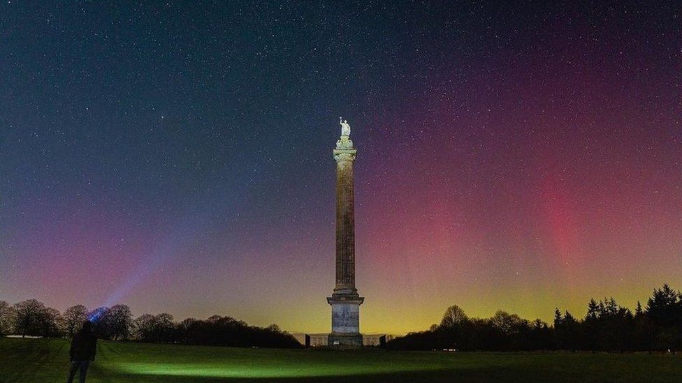 The Column of Victory was backlit by a pink haze at Blenheim Palace Northern lights in south of England