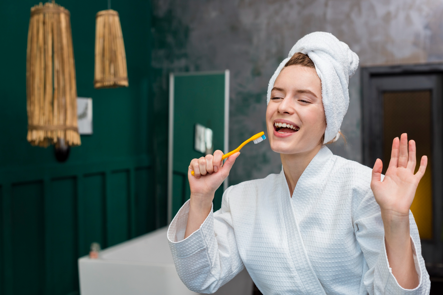 woman bathrobe playing around with toothbrush